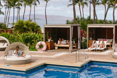 Guests Enjoy Pool Cabana