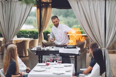 Chef cooking on portable station at table