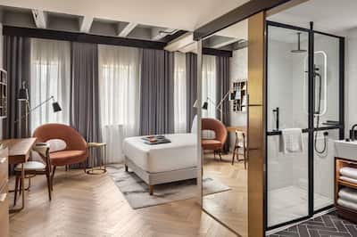 Queen bedroom with work desk and connecting bathroom with shower