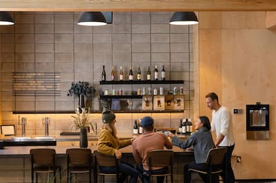 Group of people in bar area with drinks