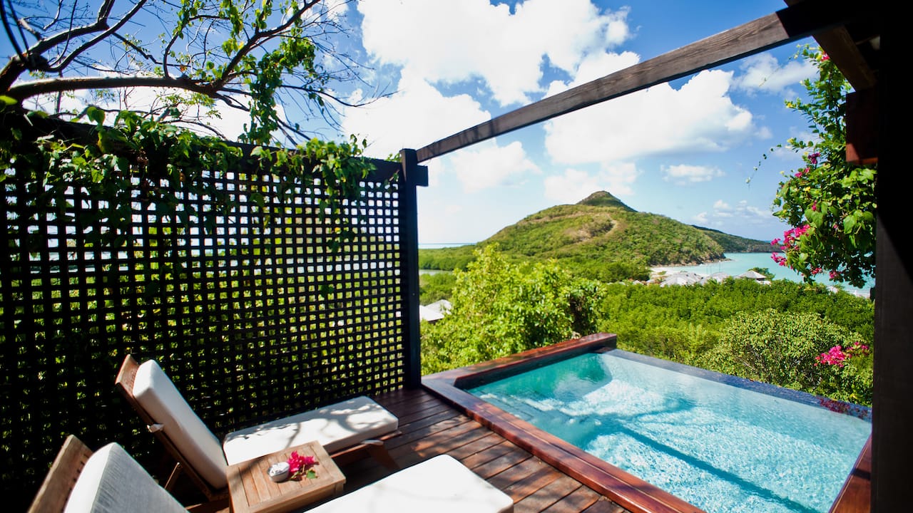 Guestroom patio with loungers and small pool