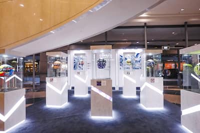 Display of McLaren F1 Team helmets set up in the lobby of Conrad Centennial Singapore