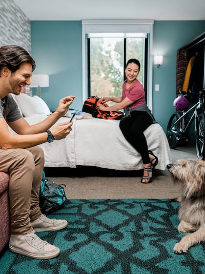 Couple in a room with their dog