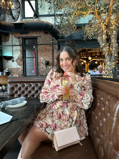woman with a drink in restaurant