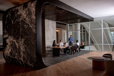 People sitting at table in lobby area