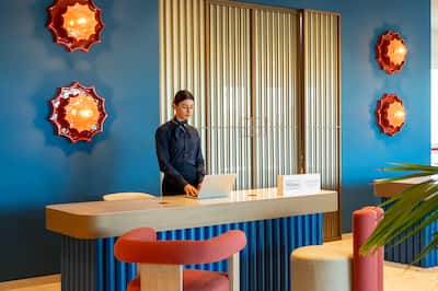 Staff Member in Reception Desk Area