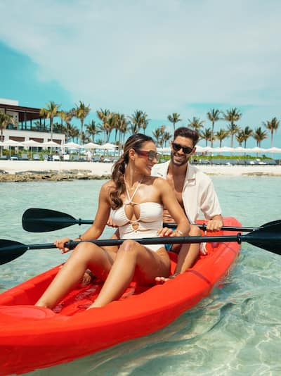 Couple in canoe in beach shore