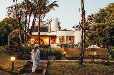 Woman Standing Outside with View of the Hotel Building