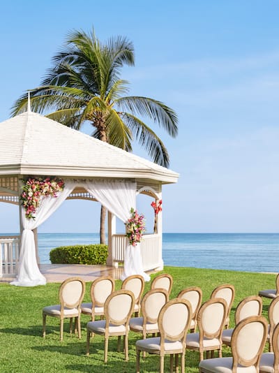 Garden overlooking ocean setup for wedding ceremony