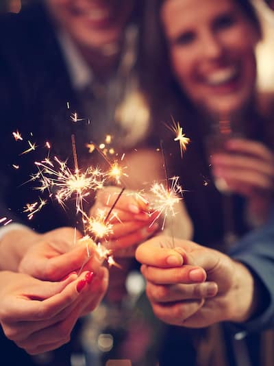 Party goers with sparklers