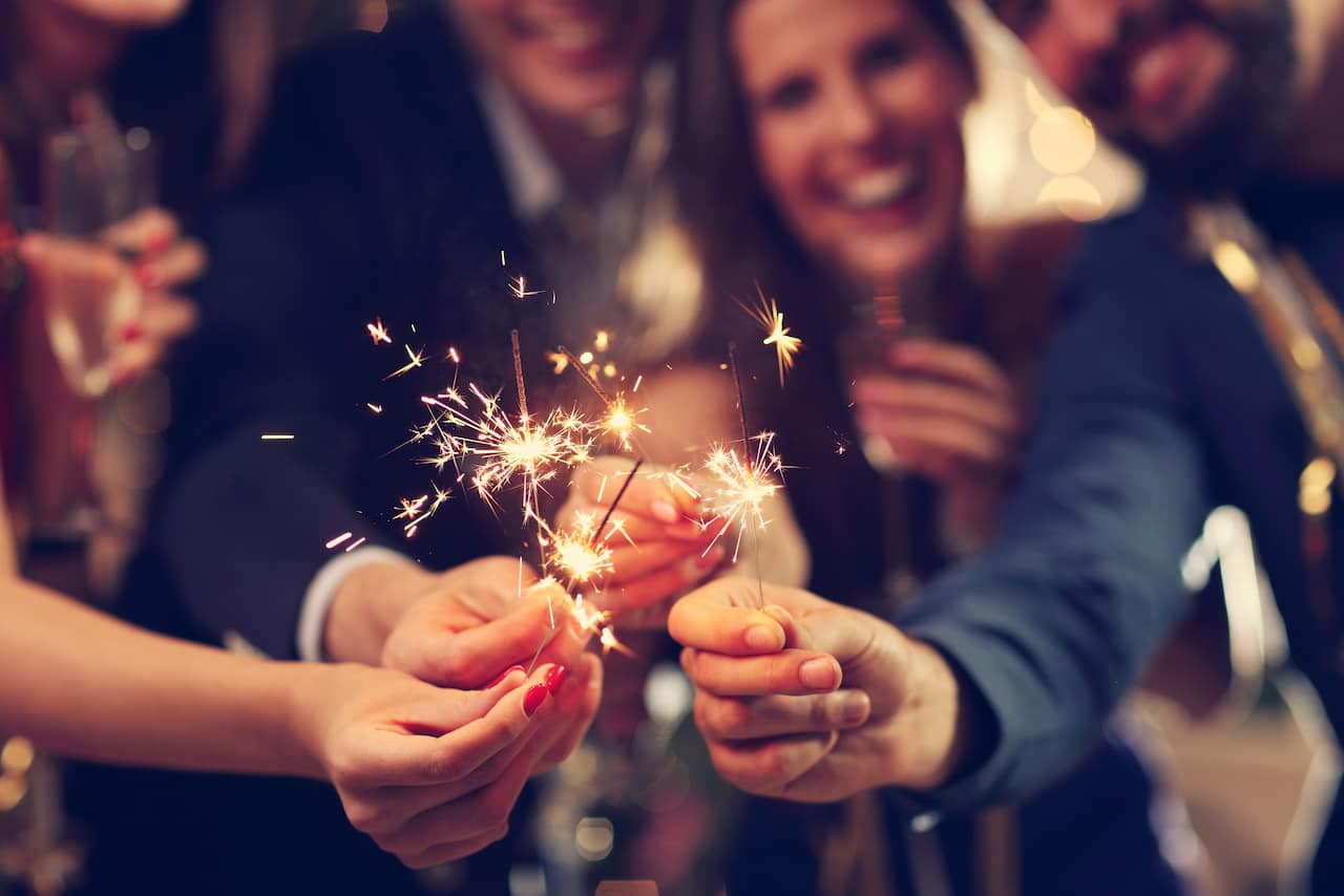 Party goers with sparklers