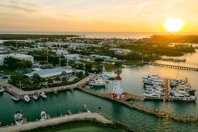 Aerial View of Hotel Exterior with Sunset on Marina